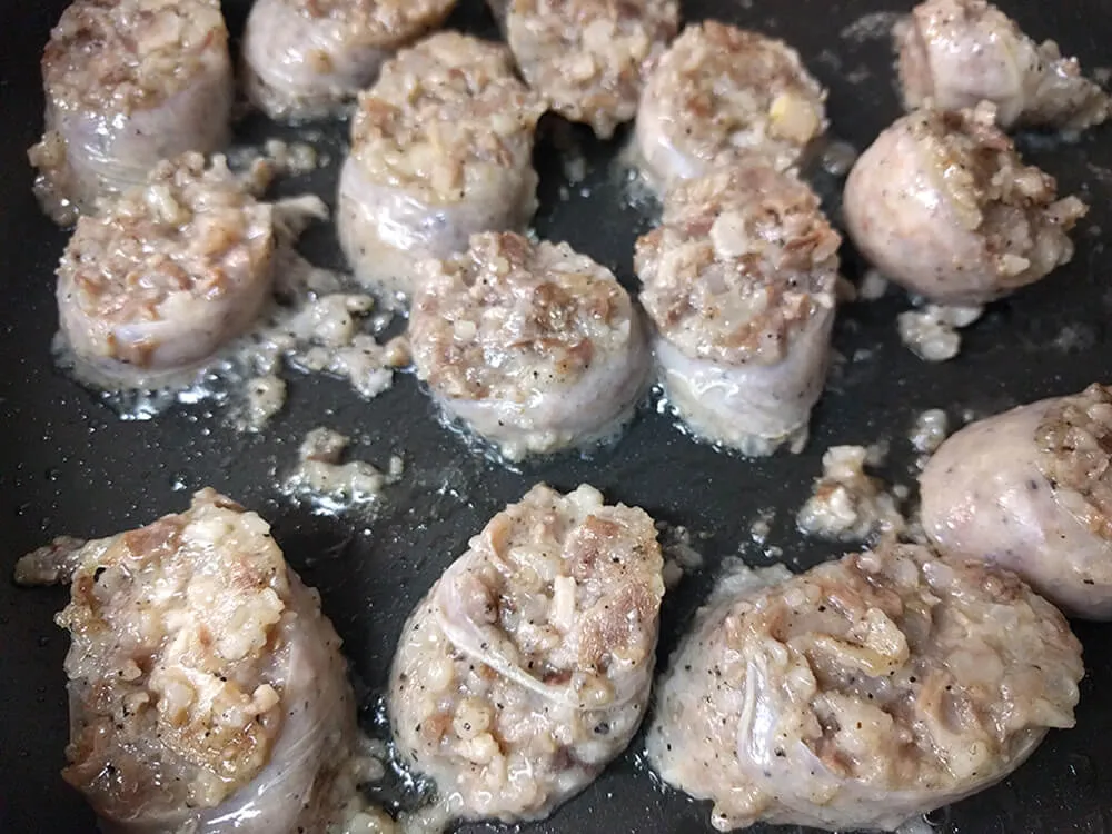 Butifarra de perol cocinándose