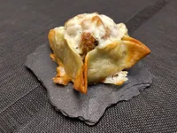 Saquito de butifarra de setas con curry.